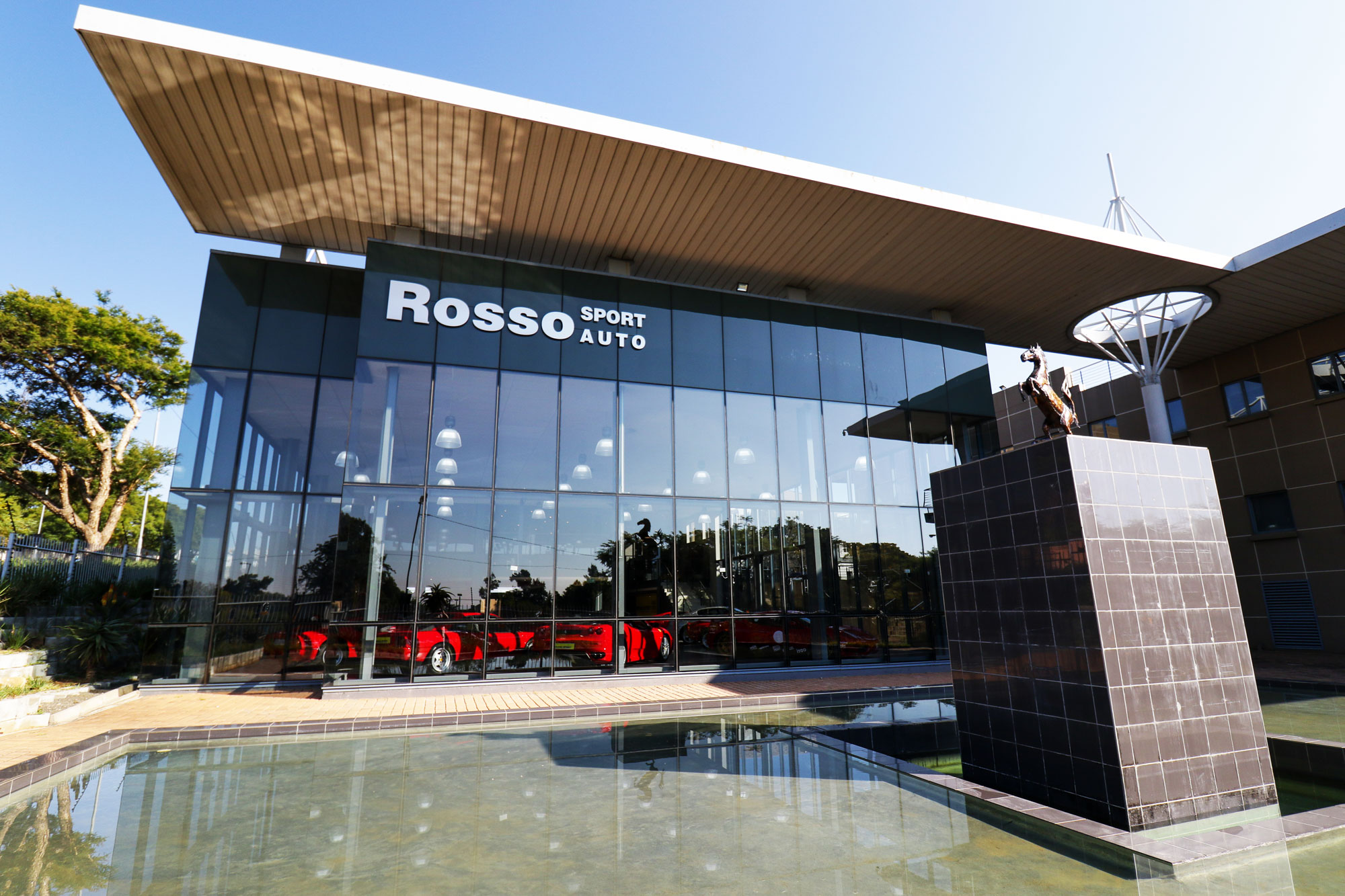 Rosso Sport Auto showroom with Ferrari collection